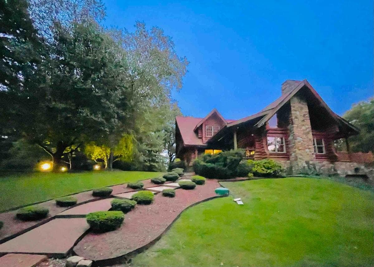 True Log Cabin! 5 Bedrm 5 full bath. Beautiful Logs from Canada. 3800 sq ft. Built on 7 beautifully landscaped acres with woods, outdoor entertainment spaces and game room. Only 25 minutes to downtown Nashville!